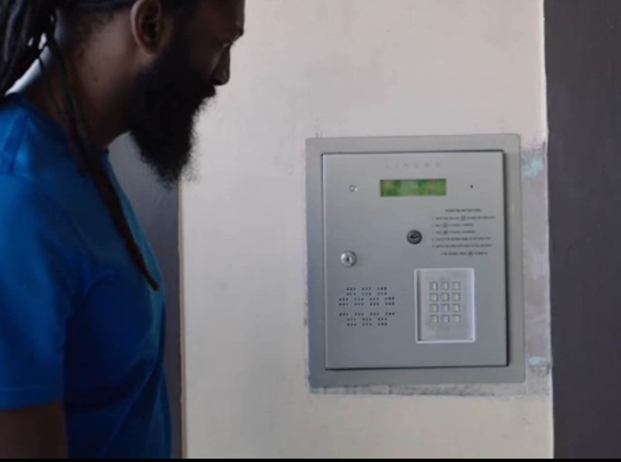 A deaf person approaching an intercom door